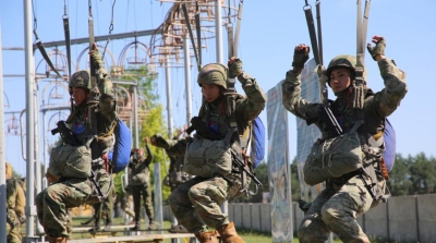 Belarusian, Chinese military practicing ground elements of parachute jump during joint drill